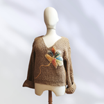 JERSEY, PULL, color beig, con aplicacion de flor en lana enfieltrada