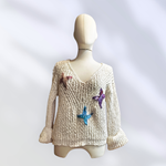 JERSEY, PULL, color crudo con aplicación de mariposas en lana enfieltrada