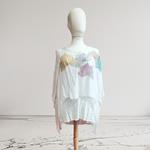 TUNICA ,blusa, vestido en gasa de seda, color arena, con fondo de lentejuelas dibujo de flores