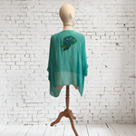TUNICA ,blusa en gasa de seda, color azul turquesa, dibujo de flores 