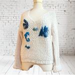 JERSEY, PULL, color crudo con aplicación de pececitos en lana enfieltrada