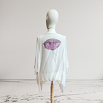 TUNICA ,blusa en gasa de seda, color arena dibujo de flores 